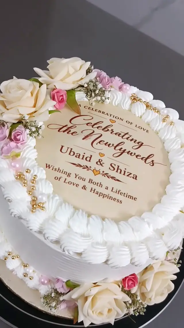 Celebrating the Newlyweds: Printed vows, cream roses